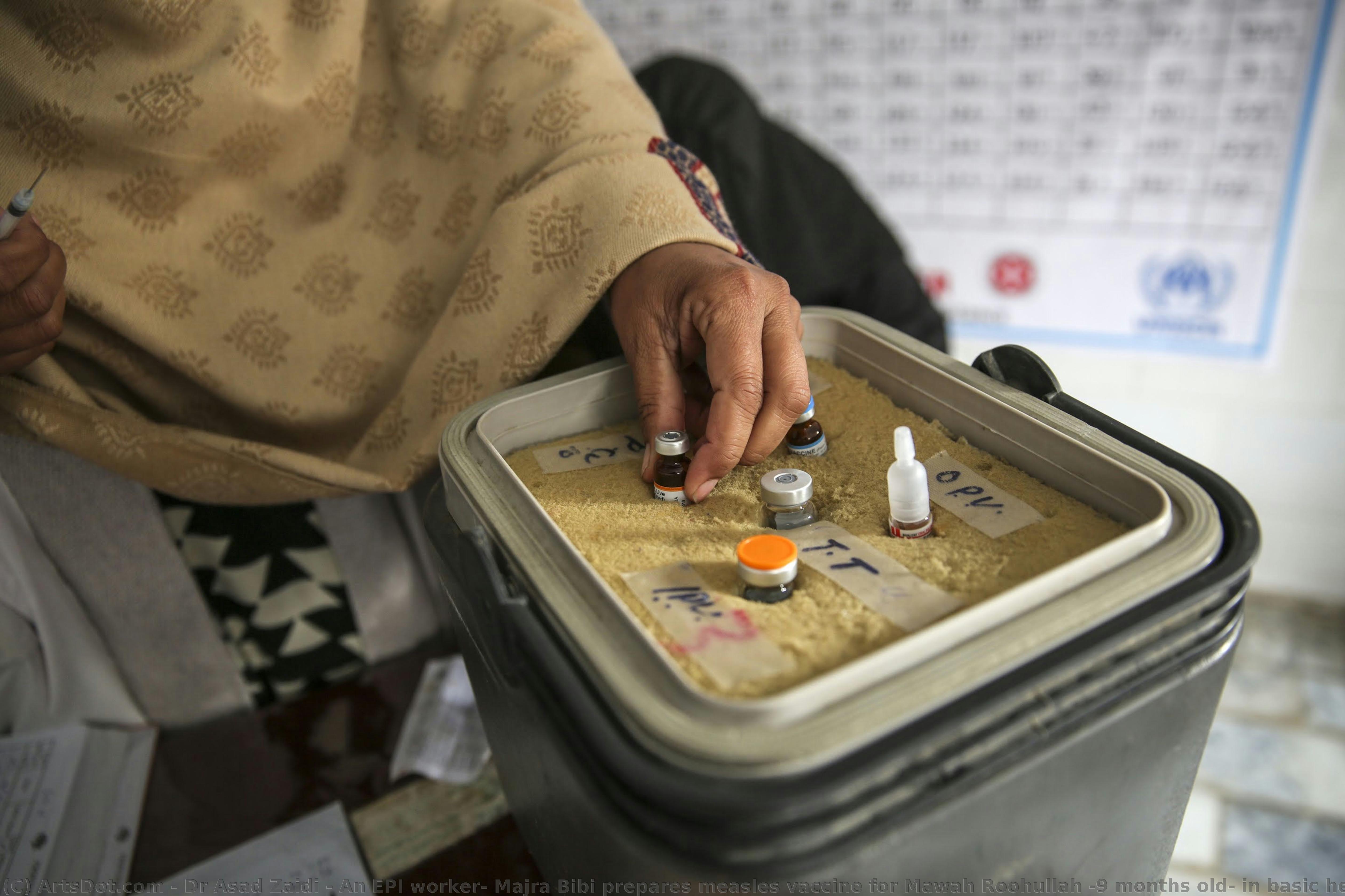 An Epi Worker, Majra Bibi Prepares Measles Vaccine For Mawah Roohullah (9 Months Old) In Basic Health Unit Akora Ii, Pakistan — Dr Asad Zaidi