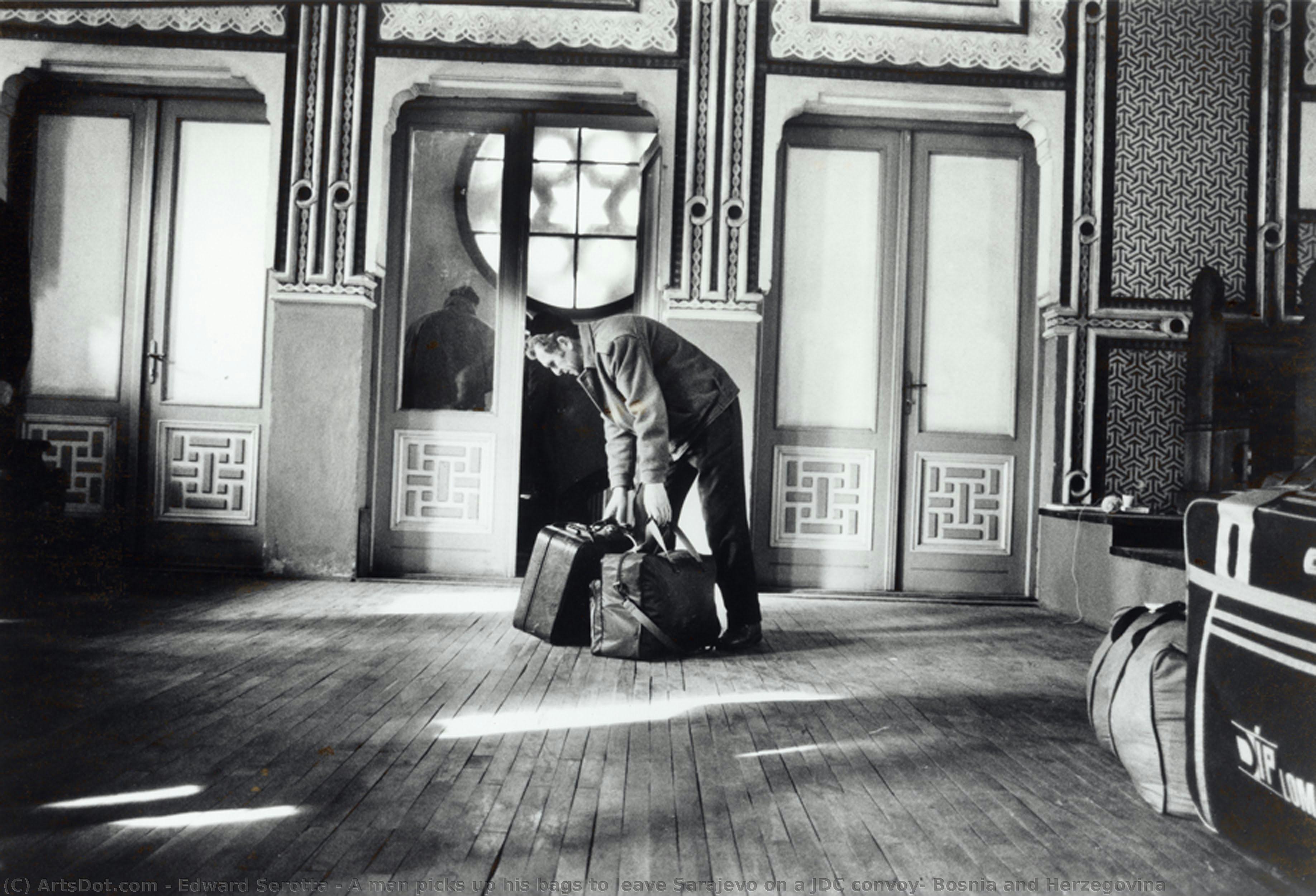 A Man Picks Up His Bags To Leave Sarajevo On A Jdc Convoy, Bosnia And Herzegovina — Edward Serotta