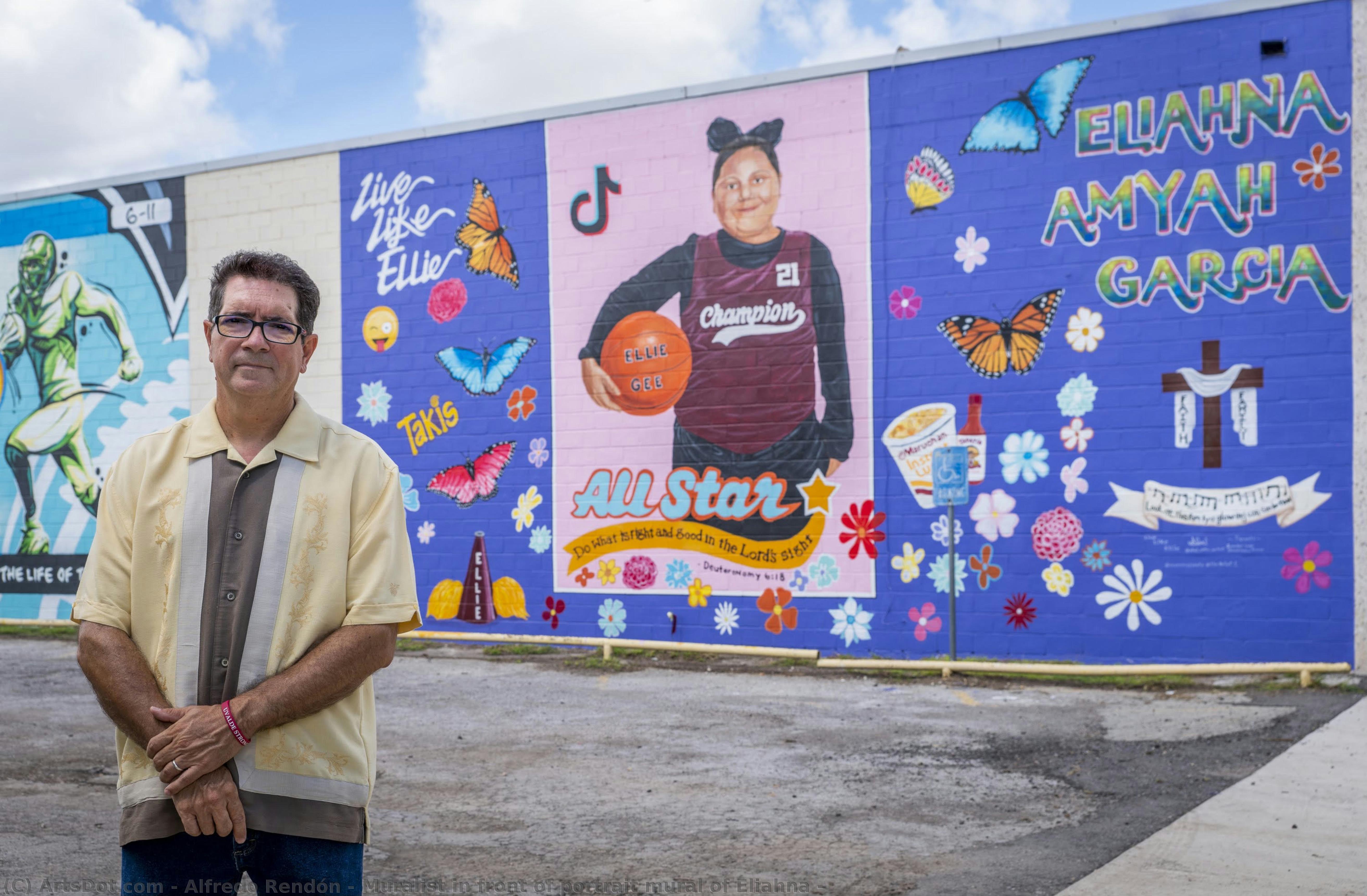 Muralist In Front Of Portrait Mural Of Eliahna — Alfredo Rendón