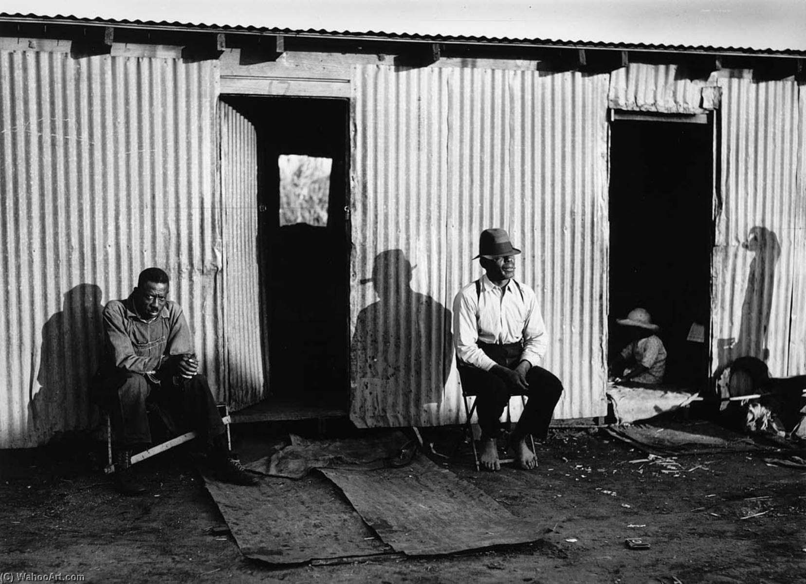 Two Black Men Sitting Outside Tin Shack — Marion Post Wolcott
