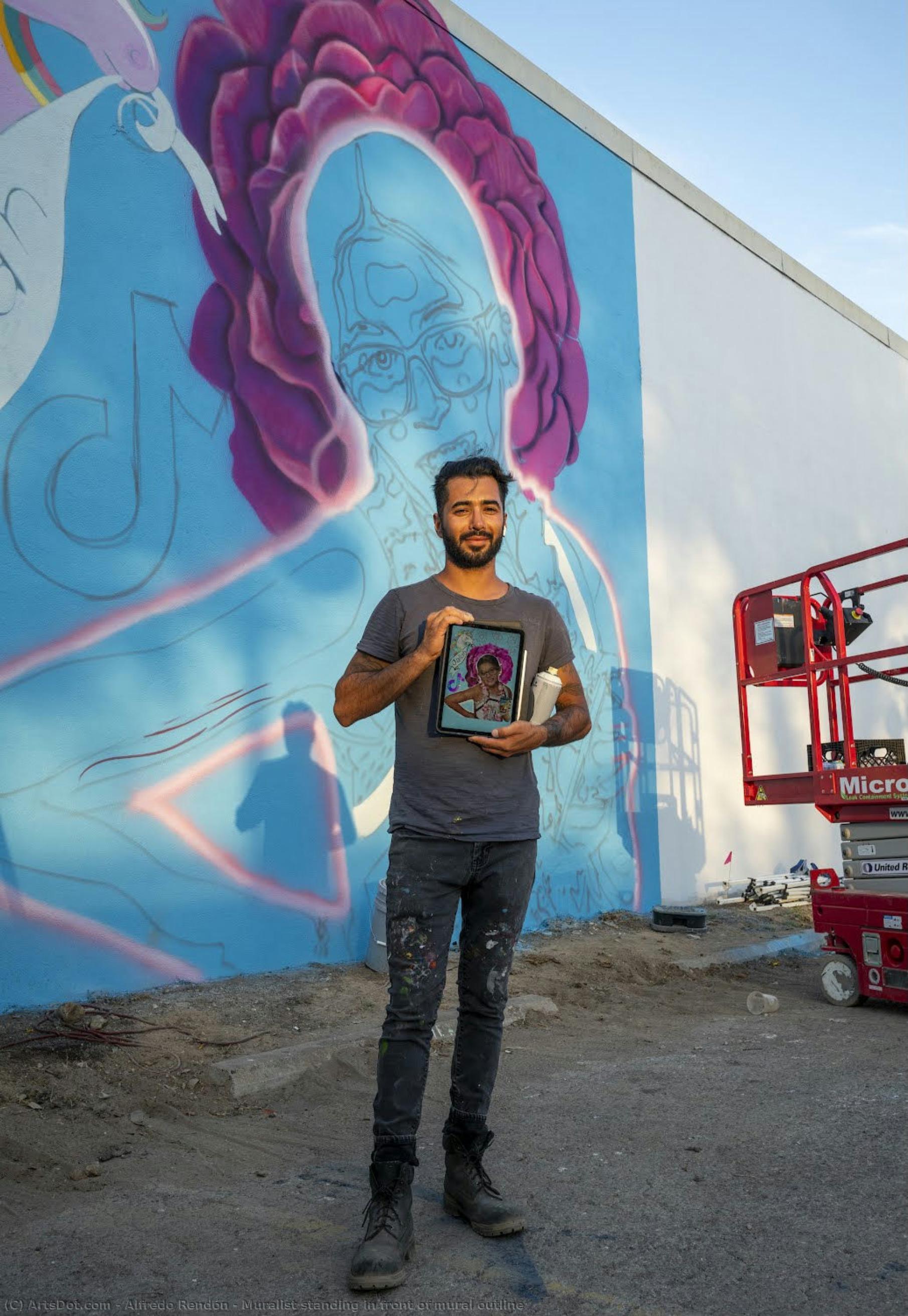 Muralist Standing In Front Of Mural Outline — Alfredo Rendón