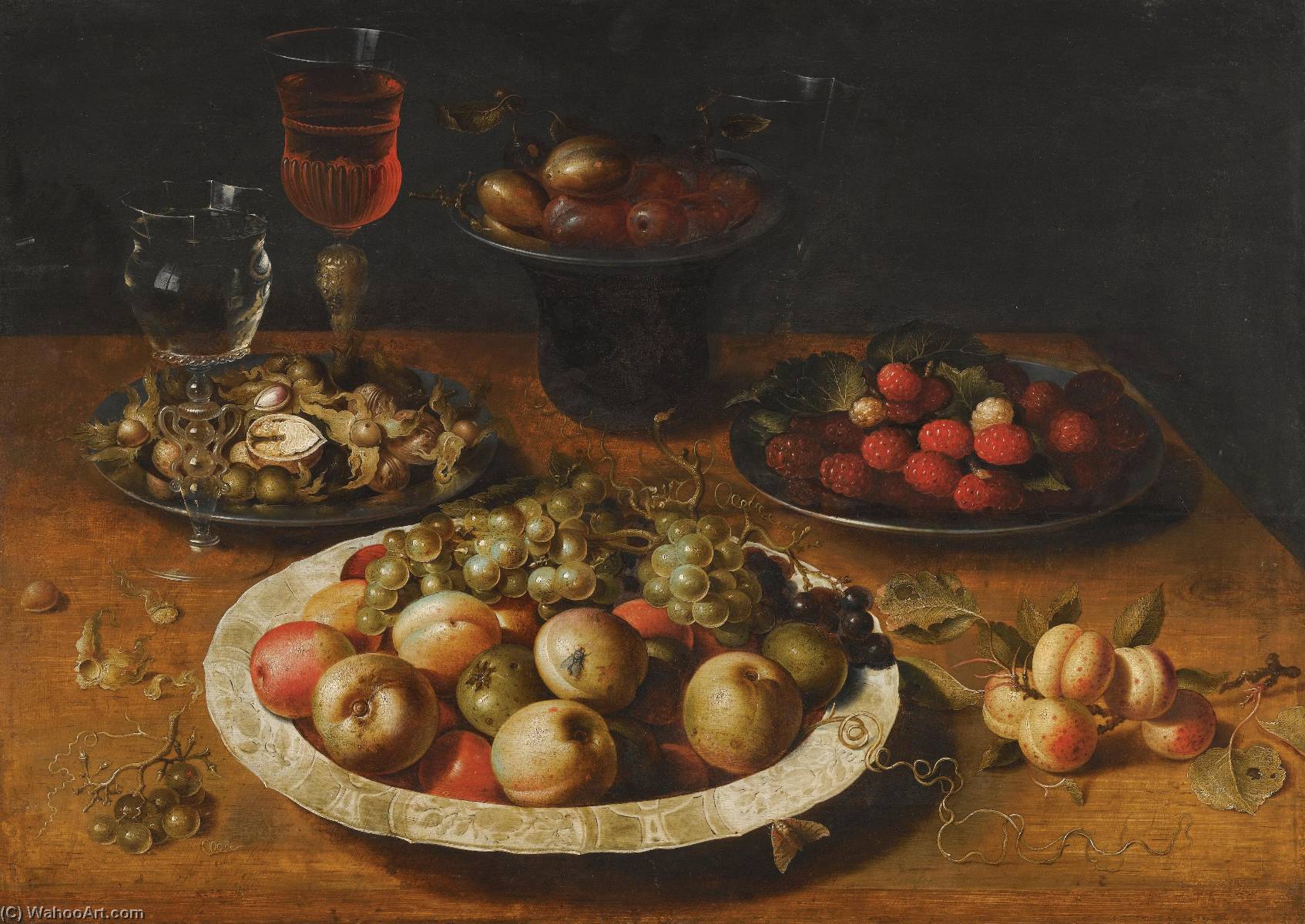 A Still Life Of Apples And Grapes In A Blue And White Porcelain Bowl, Raspberries And Walnuts In Pewter Dishes, Plums On A Pewter Dish Atop A Stand, Together With Three Wine Glasses And Sprigs Of Apricots And Gooseberries Upon A Wooden Table — Osias Beert The Elder