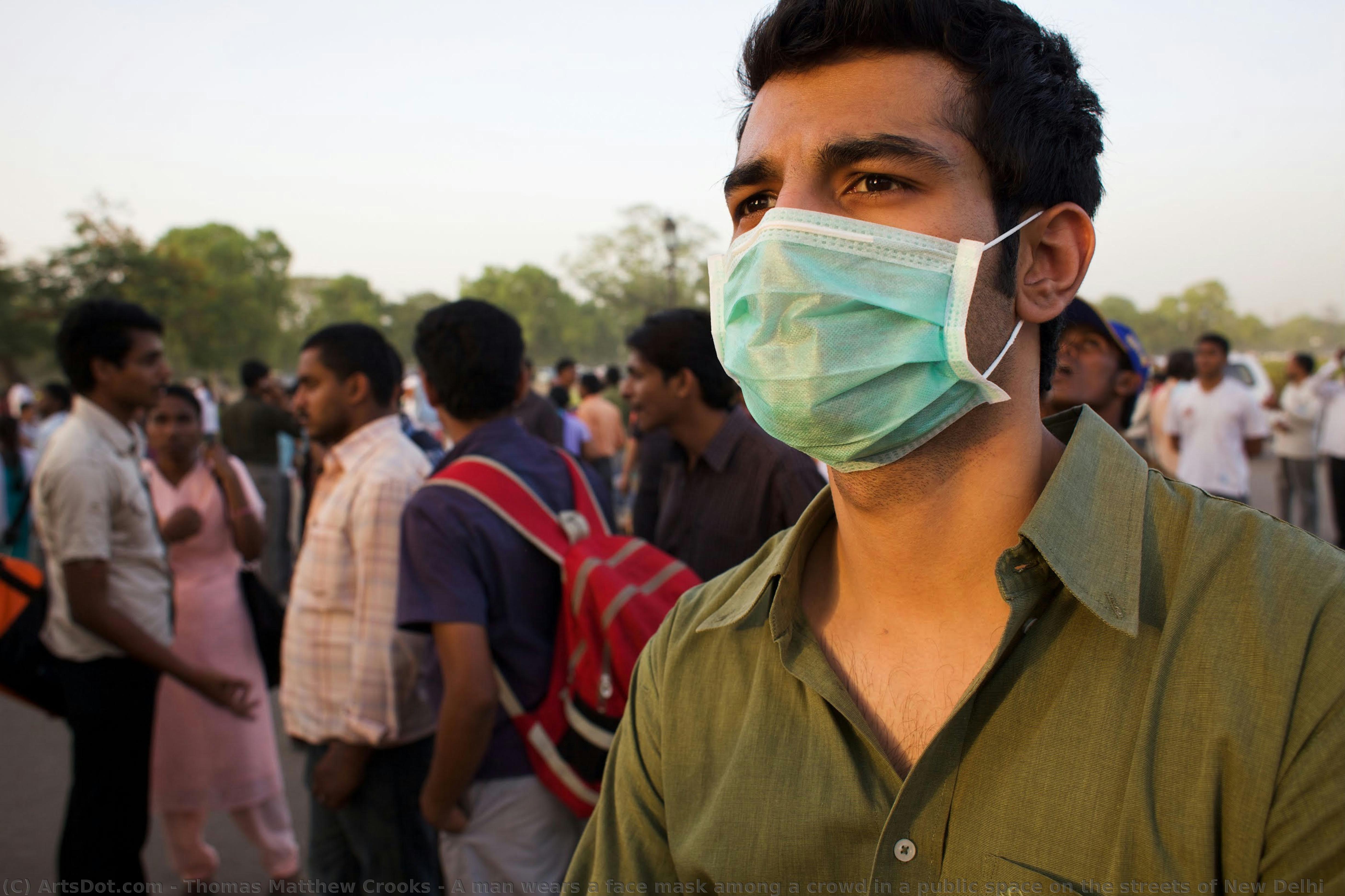 A Man Wears A Face Mask Among A Crowd In A Public Space On The Streets Of New Delhi — Thomas Matthew Crooks