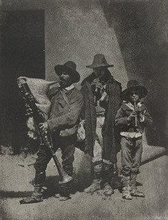 Group Of Three Bag Pipers Standing On The Corner Of 21 Quai Bourbon — Charles Nègre