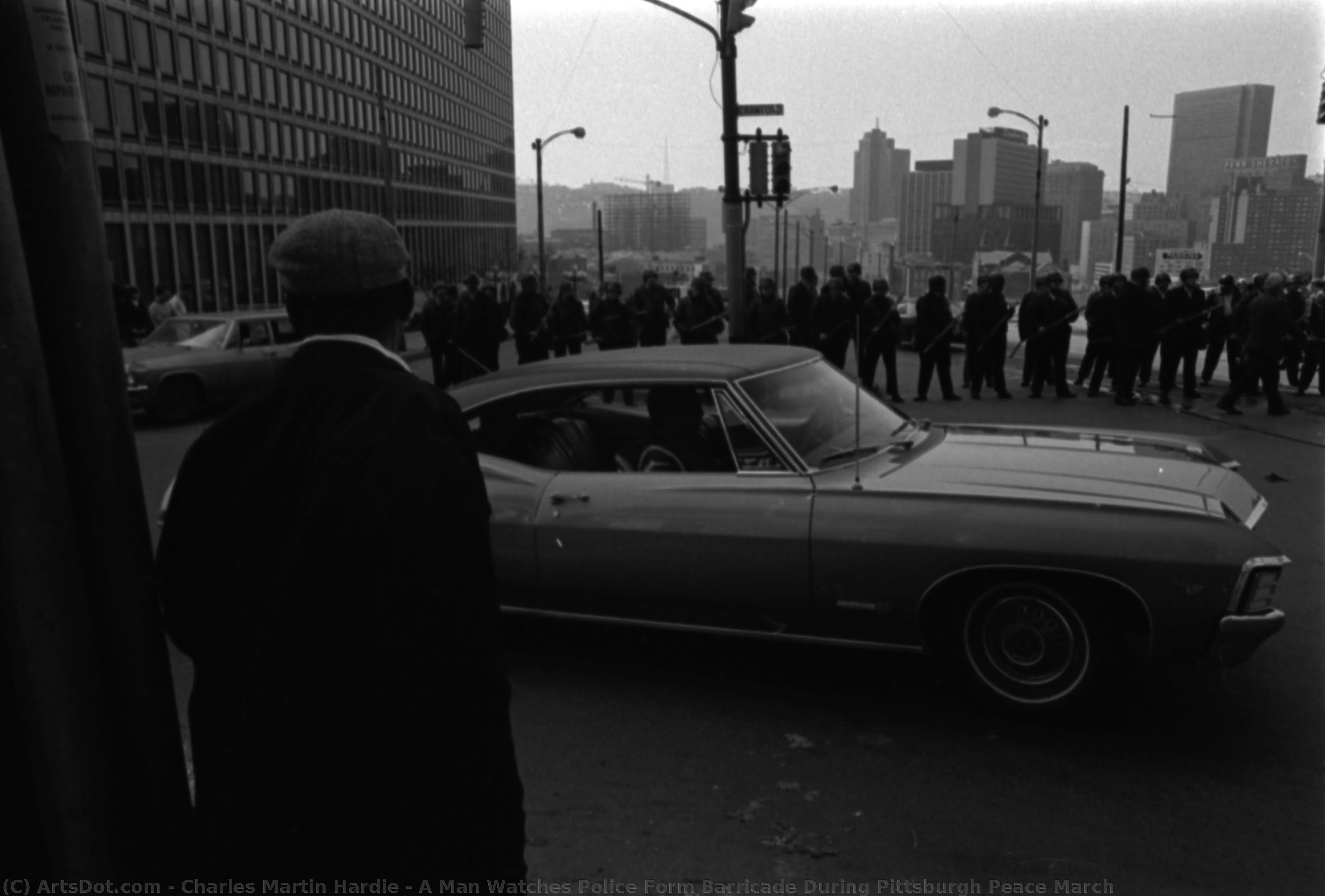 A Man Watches Police Form Barricade During Pittsburgh Peace March — Čarls Martin Hardi
