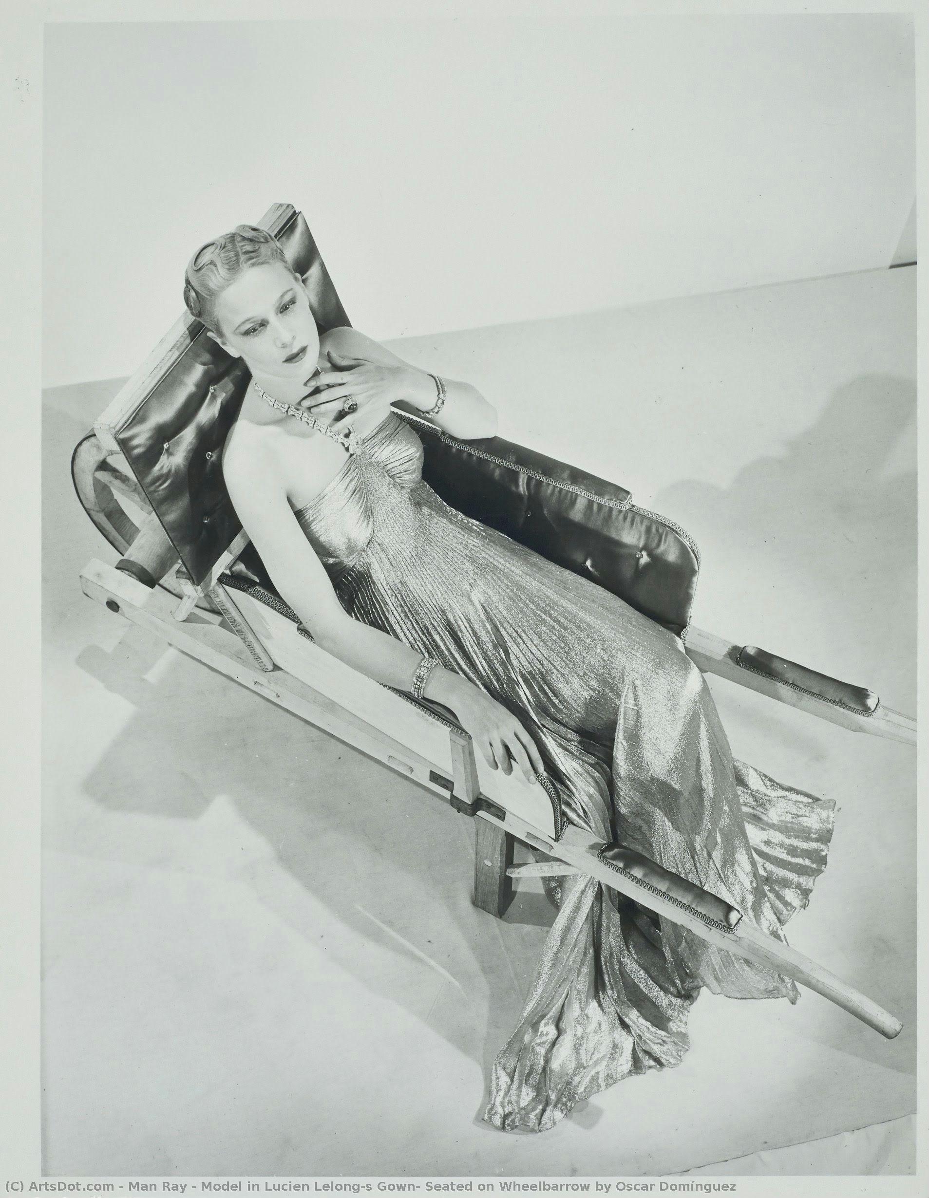 Model In Lucien Lelong’s Gown, Seated On Wheelbarrow By Oscar Domínguez — Man Ray