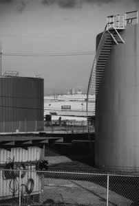 View Across Stone Oil Facility To Zatarain — Richard Sexton, Contemporary Realism