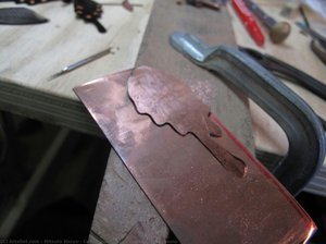Cuting out a metal plate, Jizai-okimono
