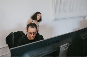 Refik Anadol makes final edits to a trailer to accompany the LA Phil’s press announcement as his wife, Efsun Erkilic, looks on.