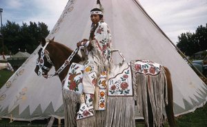 Pauline Phillips (Yakama) on horse