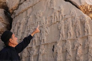 Kul-e Farah relief IV, Mr. Asadi, Bakhtiyari caretaker of Kul-e Farah reliefs with central panel A