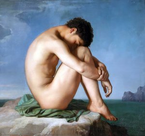 Young man sitting by the sea