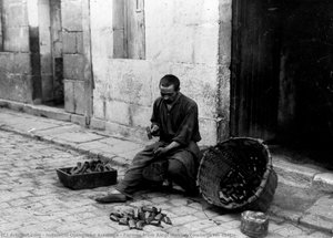 Farmer from Alegi making cowbells for cattle