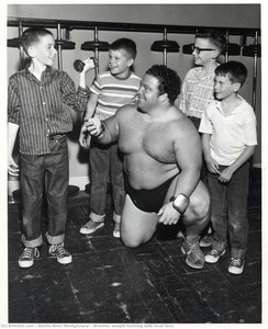 Wrestler Weight Training With Local Fans — Shirlie Alice Montgomery