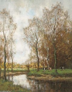 Cows Grazing By A Stream In A Wooded Landscape