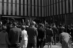 Four Individuals Stand of the Steps of the Federal Building During Pittsburgh Peace March