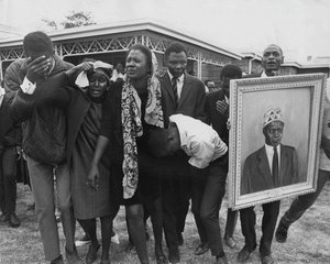 Mrs. Pamela Mboya Is Escorted To The House After Following Her Husband’s Coffin From The Mortuary In Nairobi, Kenya — Mohamed Amin, Documentary Photography
