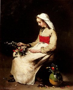 A girl arranging a vase of flowers