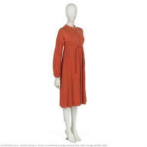 Dress in cadmium orange wool jersey with orange leather belt