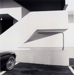 Untitled (car's Wire Wheel, White Outside Stairway) — Burk Uzzle