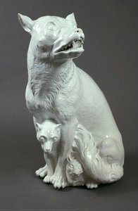 She-wolf with three wolf cubs