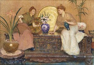 Two Ladies Sitting On A Chest