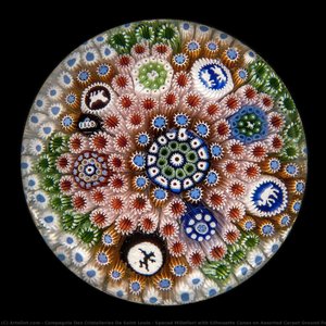 Spaced Millefiori with Silhouette Canes on Assorted Carpet Ground Paperweight