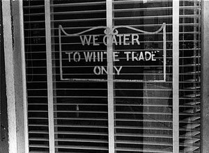 Sign on a restaurant We Cater to White Trade only