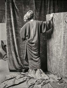 Model wearing a printed silk velvet\n tunic