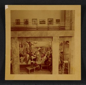 Photograph of Frida Kahlo posing for Diego Rivera as he paints the Nightmare of War, Dream of Peace fresco