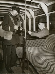 Passenger buying a Ticket from a conductor