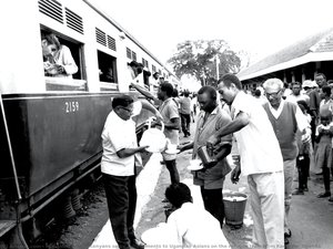 Kenyans Serve Refreshments To Ugandan Asians On The Refugee Train From Kampala, Uganda — Mohamed Amin, Photojournalism