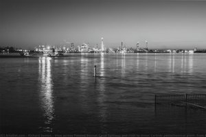 View across flooded Bonnet Carré Spillway and river to Union Carbide petrochemical plant; from Norco