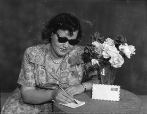 Palestinian girl writing a letter to her lover. Studio Shehrazade, Saida, Lebanon, 1950s. Hashem el Madani