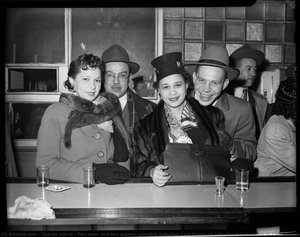 Two Men, And Two Women, Possibly Including Lola Givens On Left, Posed Behind Bar In Continental Bar At Crawford Grill No. 1 — Charles Harris
