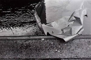 Untitled (water, paper, curb)