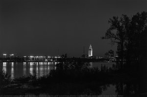 View of docks and Louisiana State Capitol; from west bank levee in Port Allen