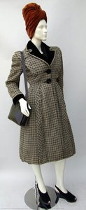 Black and brown houndstooth check coat with black velvet collar