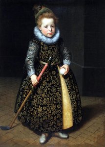 Portrait of a four-year old boy with a club and ball