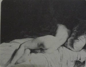 Nude woman lying from the back
