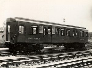 Three-quarter side view of Q35-stock trailer car no 8058 at Ealing Common depot