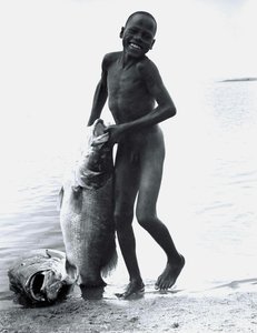 An El-molo Boy With His Nile Perch Catch — Mohamed Amin, Impressionism