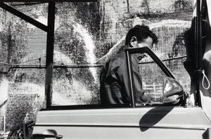 (Untitled triptych, right panel man next to car)