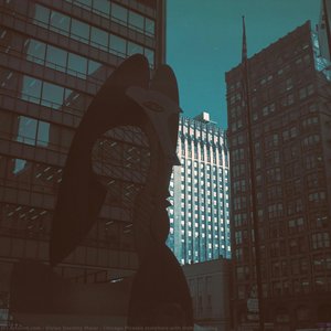 Chicago Picasso sculpture with Unity Building