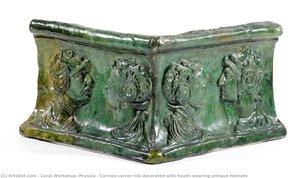 Cornice corner tile decorated with heads wearing antique helmets