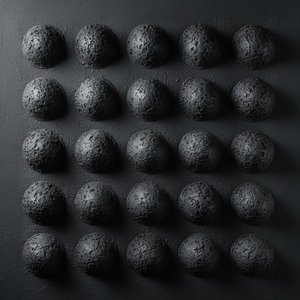 Monolithic Obsidian Orbs: A Meditative Study Of Geometric Texture And Shadow — David Moreau