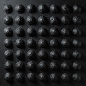 Monolithic Orbs In Obsidian: A Singular Study Of Rhythmic Shadow And Carbon Texture — David Moreau