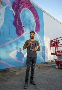 Muralist Standing In Front Of Mural Outline — Alfredo Rendón