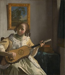 Youg woman playing a guitar
