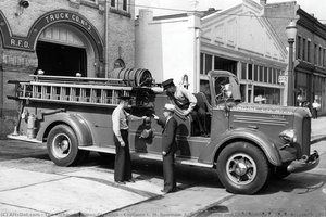 Captains L. M. Bowman, F. W. Schneider And Chief Ainslee F. Taylor Inspect A 1942 Mack Pumper Truck — The Richmond Times-dispatch